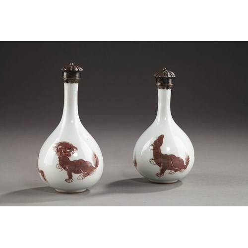 Two vases bottle with copper red decoration of  Mythical animals